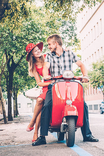 istock Young Couple Exploring the City on a Vintage Scooter 604828990
