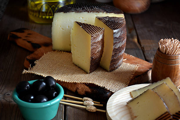 Pieces of manchego cheese cured stock photo