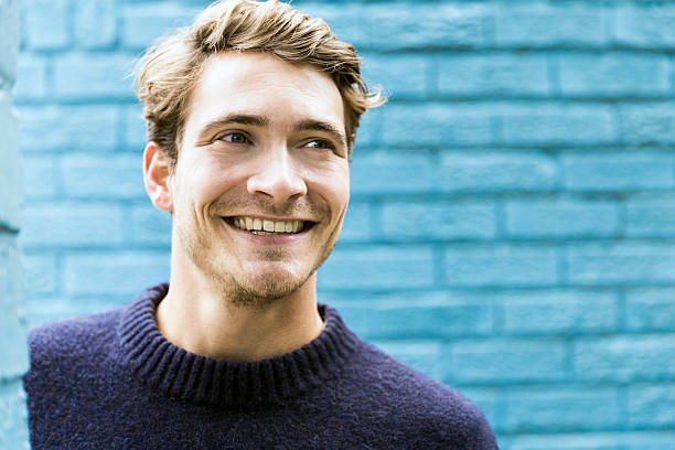 istock Close-up of young man looking away 604831220