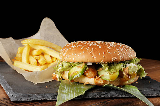 istock Cheeseburger (burger) with french fries and sauce 604832178