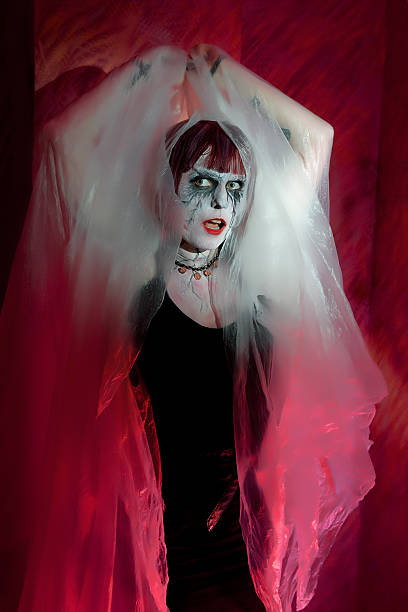 istock female zombie in misty mystical garb 604832578