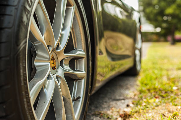 Extreme close up shot wheel with trademark. Porsche Cayman stock photo