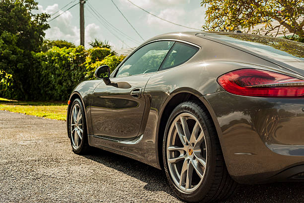 Full shot sideways. Porsche Cayman in residential area stock photo