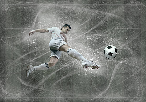 istock Football player with ball in action under sky with clouds 604860094