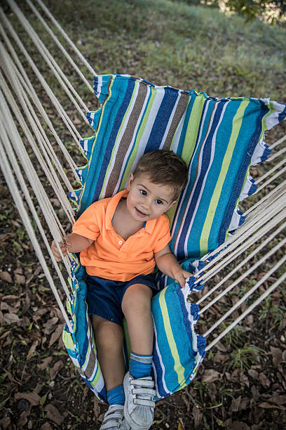 istock Baby boy in the swing 604864048