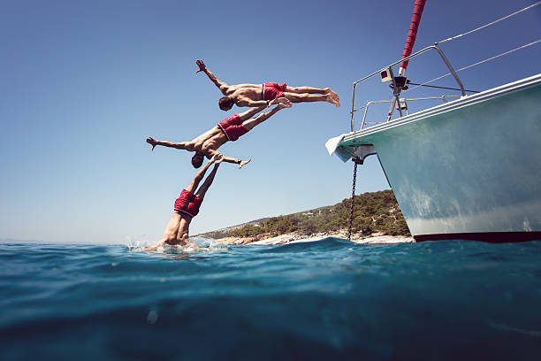 istock Diving into the sea from yacht sequence shoot 604864506
