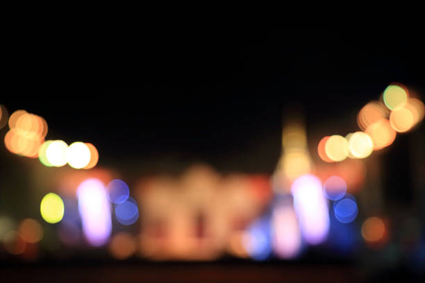istock Multicolored city lights blurred bokeh background. 604864798