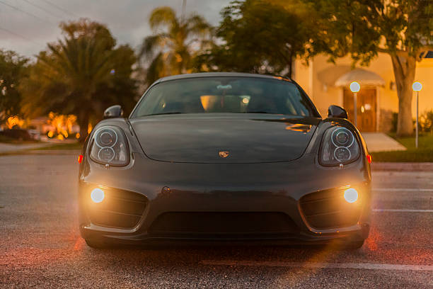 Front view with headlamps on of a Porsche Cayman stock photo