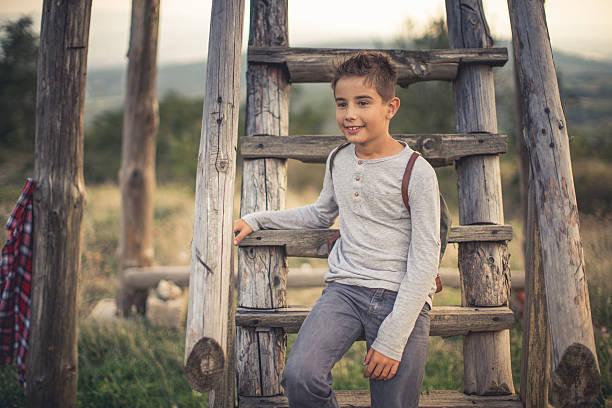 Boy standing on the wooden watchtower