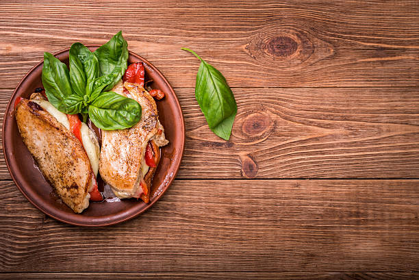 istock Roasted red pepper, mozzarella and basil stuffed chicken. 604868680