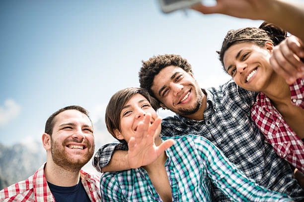 istock group of friends doing a selfie on the mountain 604869046