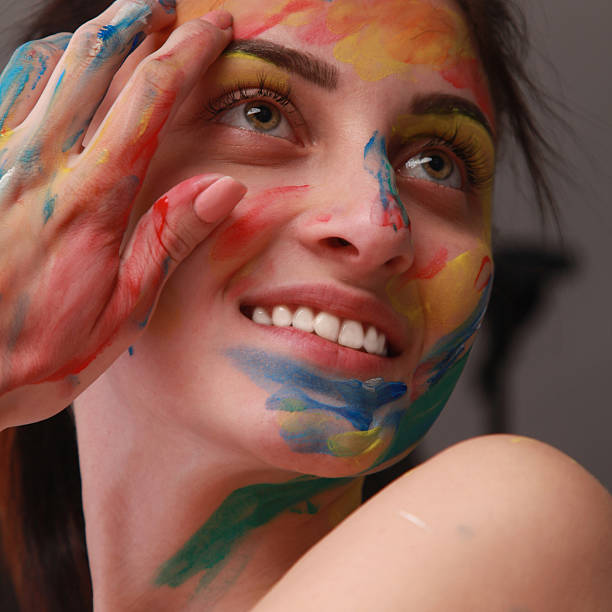 istock Bright beautiful girl with art colorful make-up 604888362