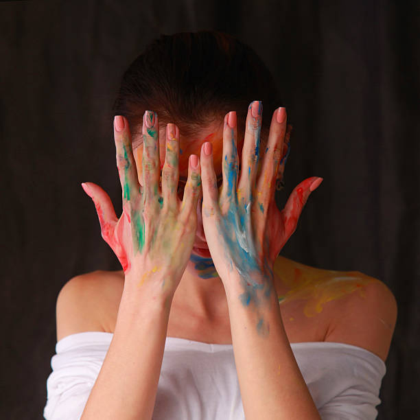 istock Bright beautiful girl with art colorful make-up 604889864