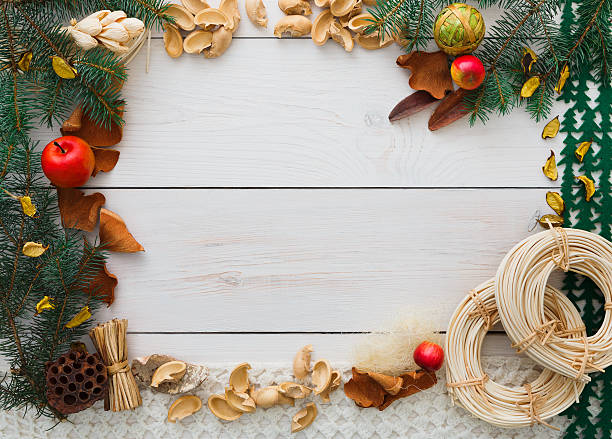 istock Christmas decoration handmade frame on white wood background copy space 604903160