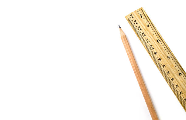 istock Wooden pencil an ruler on white isolated background 605738732