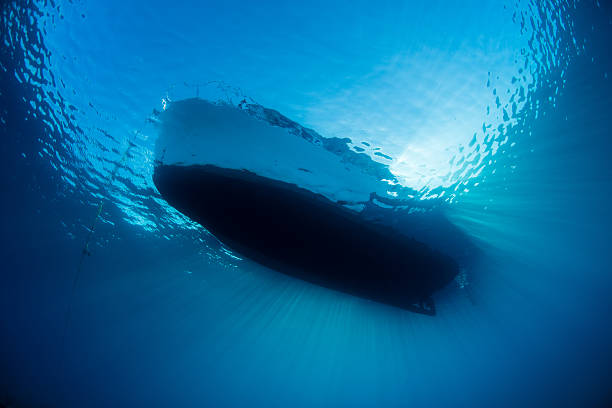 istock Blue Water and Small Boat 605738910