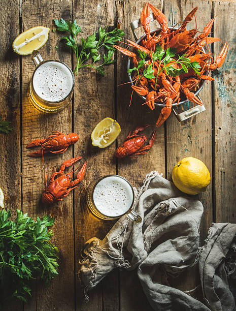istock Wheat beer and boiled crayfish with lemon, parsley 605739164