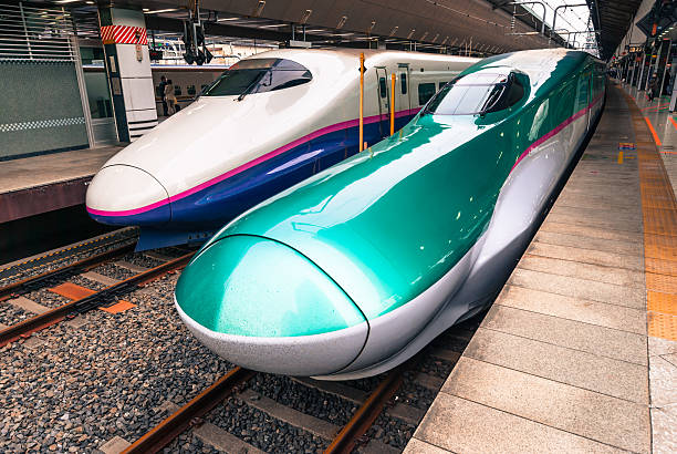 Shinkansen at Tokyo station Tokyo, Japan - March 16, 2016: Series E5 and series E2 shinkansen 'bullet trains' waiting to depart at Tokyo station tokyo bullet train stock pictures, royalty-free photos & images