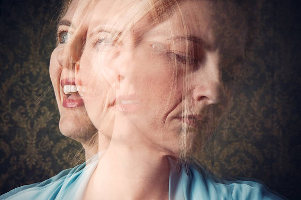 Woman Mood Disorder Concept A multi-exposure conceptual image of a woman expressing happiness and sadness. bipolar disorder stock pictures, royalty-free photos & images