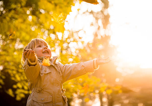 istock Autumn season - enjoying child 605744512