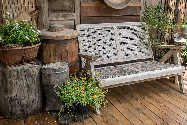 istock Wood bench on concrete floor 605744824