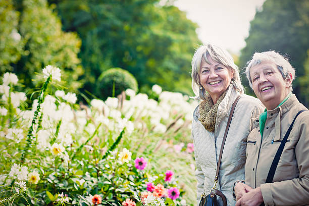 istock Two ladies in city garden 605745644