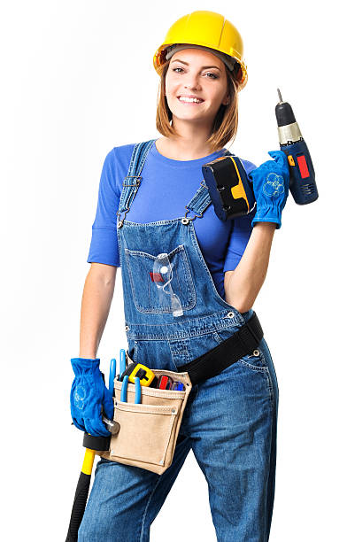 Young Woman Contractor Construction Carpenter with Drill on Whit Young Woman Contractor Construction Carpenter with Drill on White woman wearing tool belt stock pictures, royalty-free photos & images