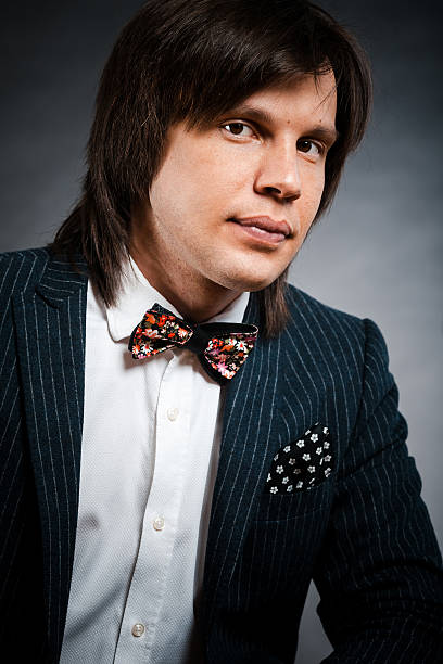 istock handsome man with long hair brunette and brown eyes in 605749042