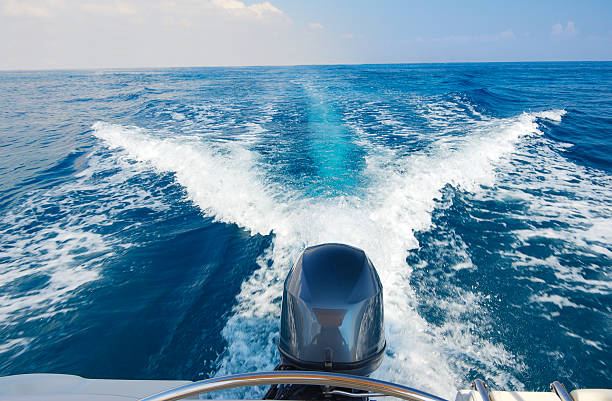 Boat engine Boat engine in motion at sea sea wake stock pictures, royalty-free photos & images