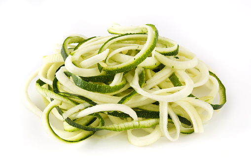 Zucchini noodles isolated on white background