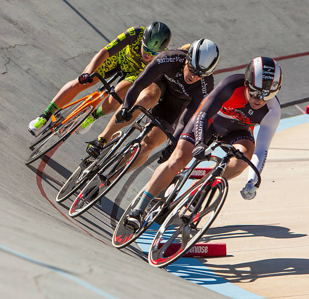 Portland, Oregon USA - August 27, 2016: Competitors exiting a corner at the Oregon Bicycle Racing Association Championships at the Alpenrose Dairy Velodrome. A velodrome is an arena for track cycling. Modern velodromes feature steeply banked oval tracks, consisting of two 180-degree circular bends connected by two straights.