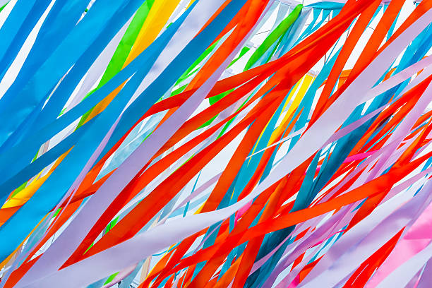 istock Colorful fabric ribbons wave in the wind 605754348
