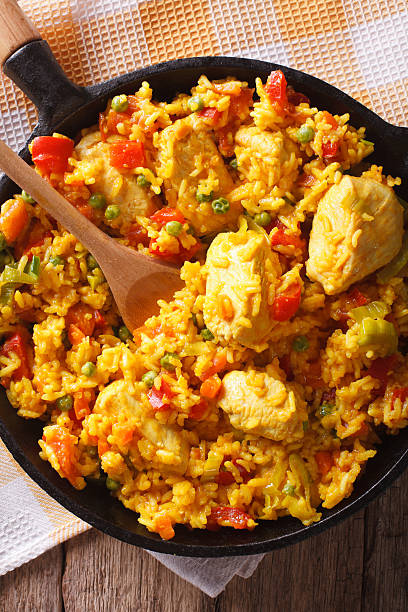 istock Hispanic cuisine: Arroz con pollo closeup in a pan. vertical 605754766