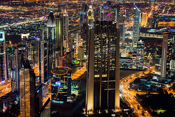 istock Futuristic Dubai at Night Aerial View 605755050