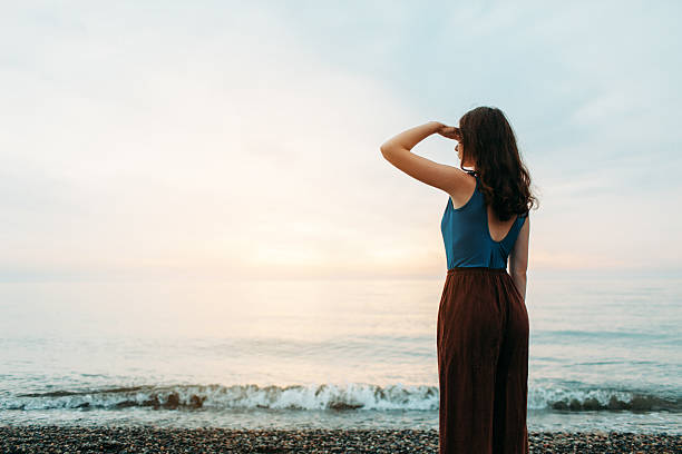 istock Girl  on beach 605755360