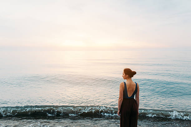 istock Girl  on beach 605755386