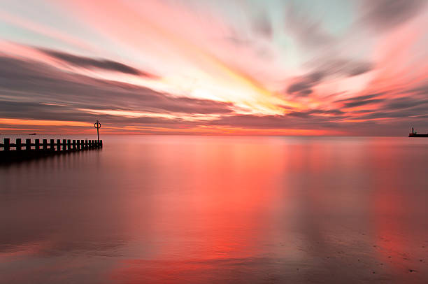 istock Sunrise reflection in Aberdeen Beach long exposure 605756724