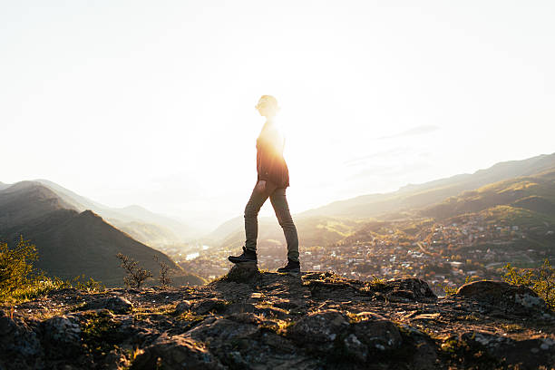 istock Woman at sunset 605756784