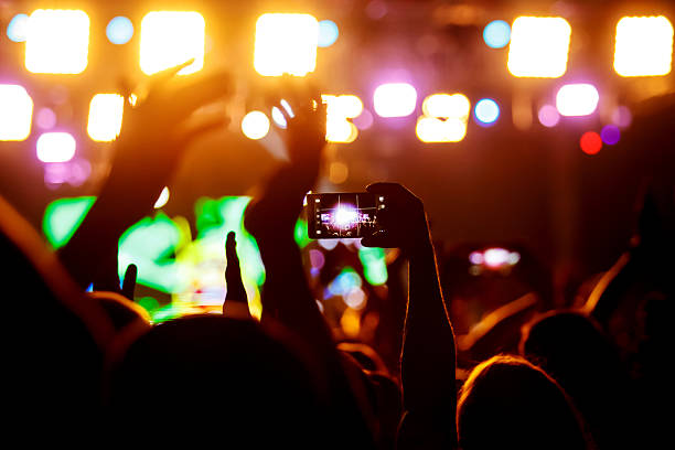 istock People makes photo with His smartphone on concerts 605757108