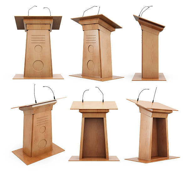 Set of wooden podium tribune with microphones isolated on white Set of wooden podium tribune with microphones isolated on white background. 3d rendering. tribune tower stock pictures, royalty-free photos & images