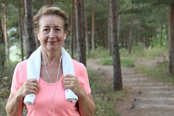 istock Senior woman resting after intense training 605758356