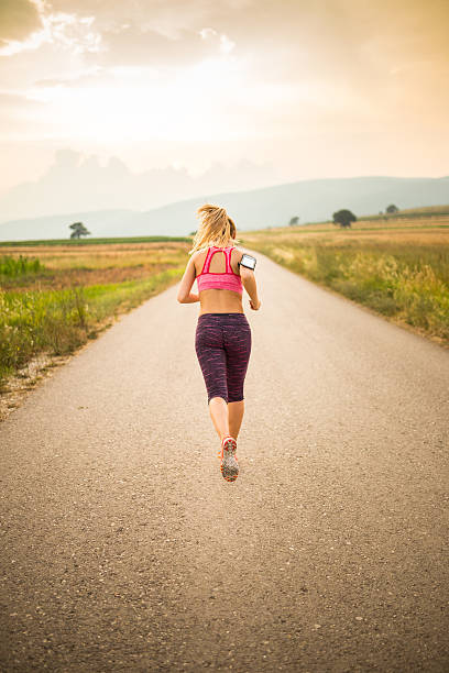 istock Woman jogging outdoors 605758880