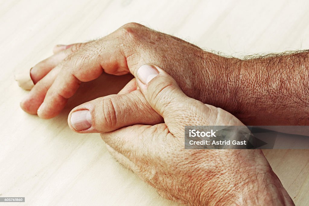 man has pain in his hand A man has pain in his hand Human Bone Stock Photo
