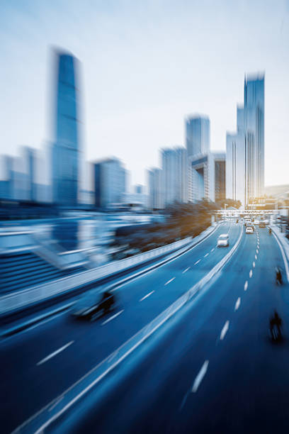 istock City road with moving car 605764974