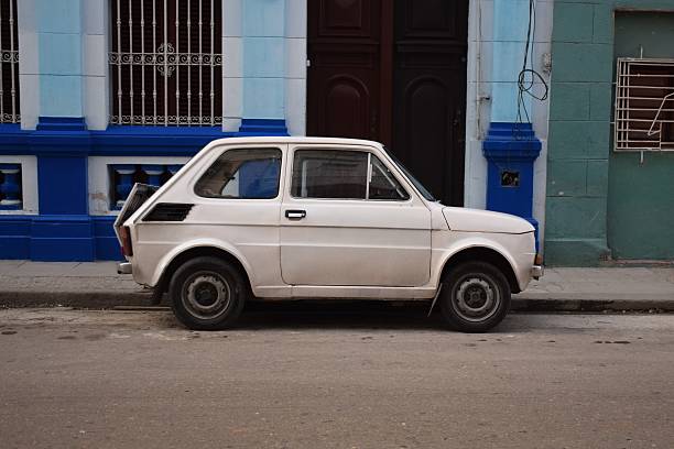 istock Old small car parked on the street 605765348