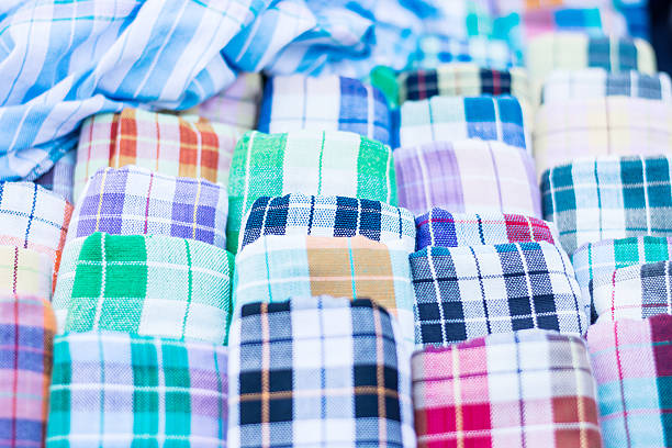 istock Multicolored fabric in outdoor market 605766526