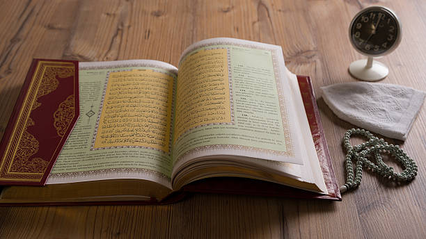 istock The Holy Book Koran and prayer beads 605766728