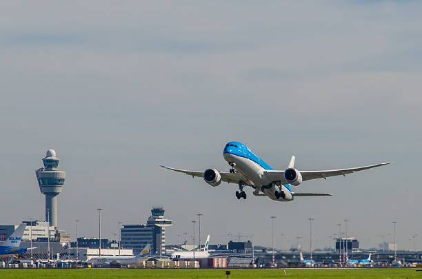 Boeing 787-9 Dreamliner of KLM taking off at Schiphol. Amsterdam, The Netherlands - February 26, 2016: Boeing 787-9 Dreamliner of KLM taking off at Schiphol. KLM - Koninklijke Luchtvaart Maatschappij N.V. (Royal Dutch Airlines) is the flag carrier airline of the Netherlands. landing touching down stock pictures, royalty-free photos & images