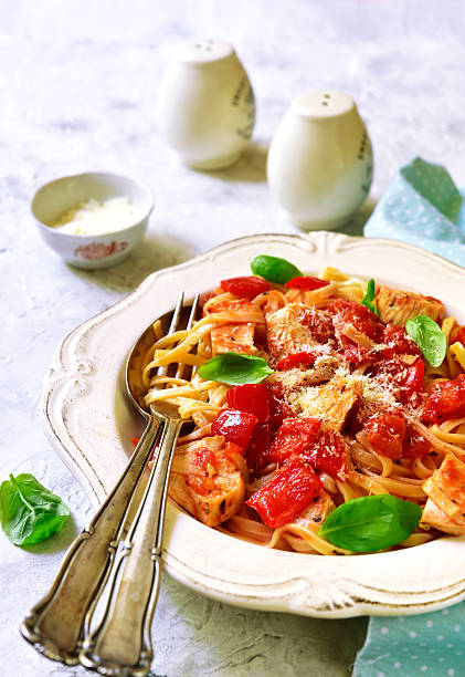 istock Tagliatelle with chicken,bell pepper and tomatoes.Top view. 605767862