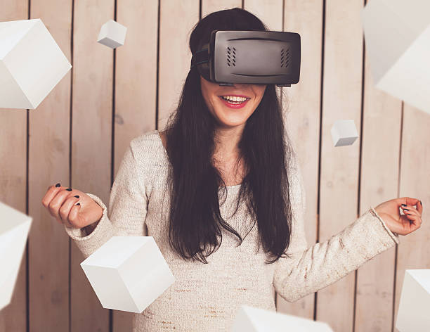 istock Woman in VR glasses 605769090
